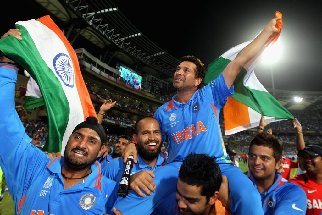 Sachin being carried by his team mates after the world cup victory in 2011