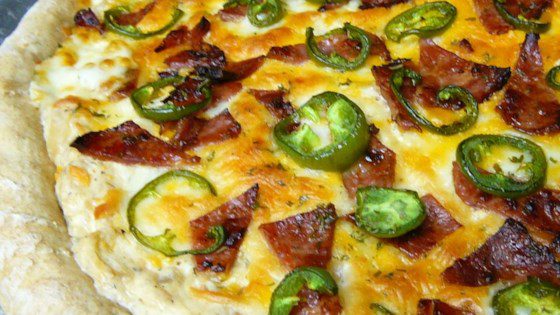 Image of a pizza with jalapeno and bacon toppings