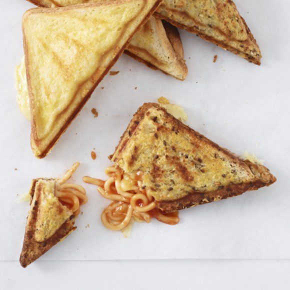 Top 10 Snacks Under 10 mins - Image of spaghetti cheese jaffles served in a porcelain plate