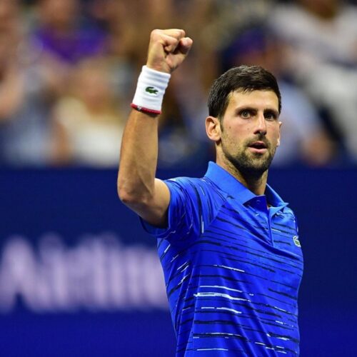 Novak Djokovic with his right hand fist held high